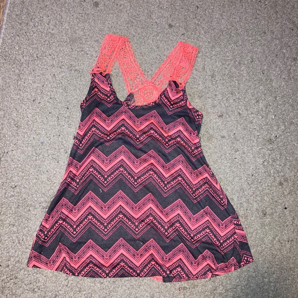 A pink and grey tank top with lace.